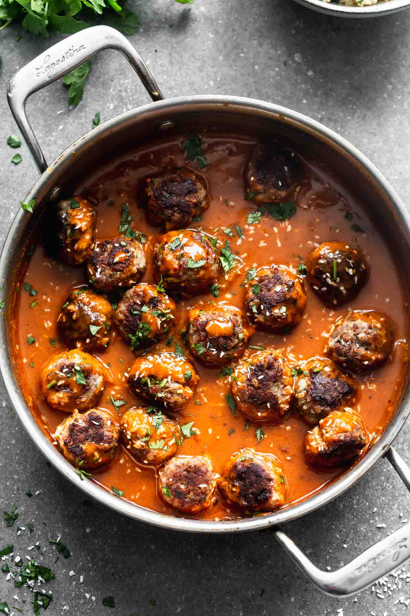These Coconut Curry Meatballs require minimal ingredients, but have SO much flavor. They're packed with garlic, ginger, onion and cilantro, browned until crisp, and bathed in a luscious coconut curry sauce. Only 30 minutes from start to finish!&nbsp;