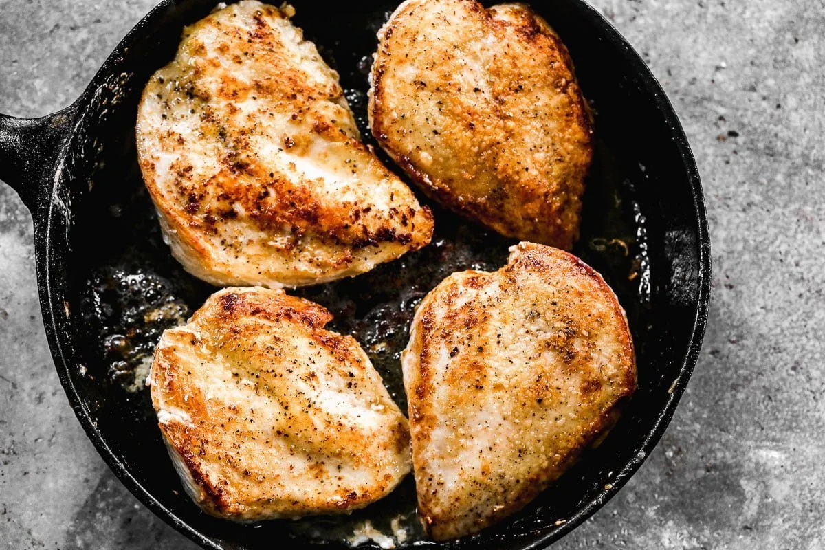 Chicken breasts seared in butter and olive oil