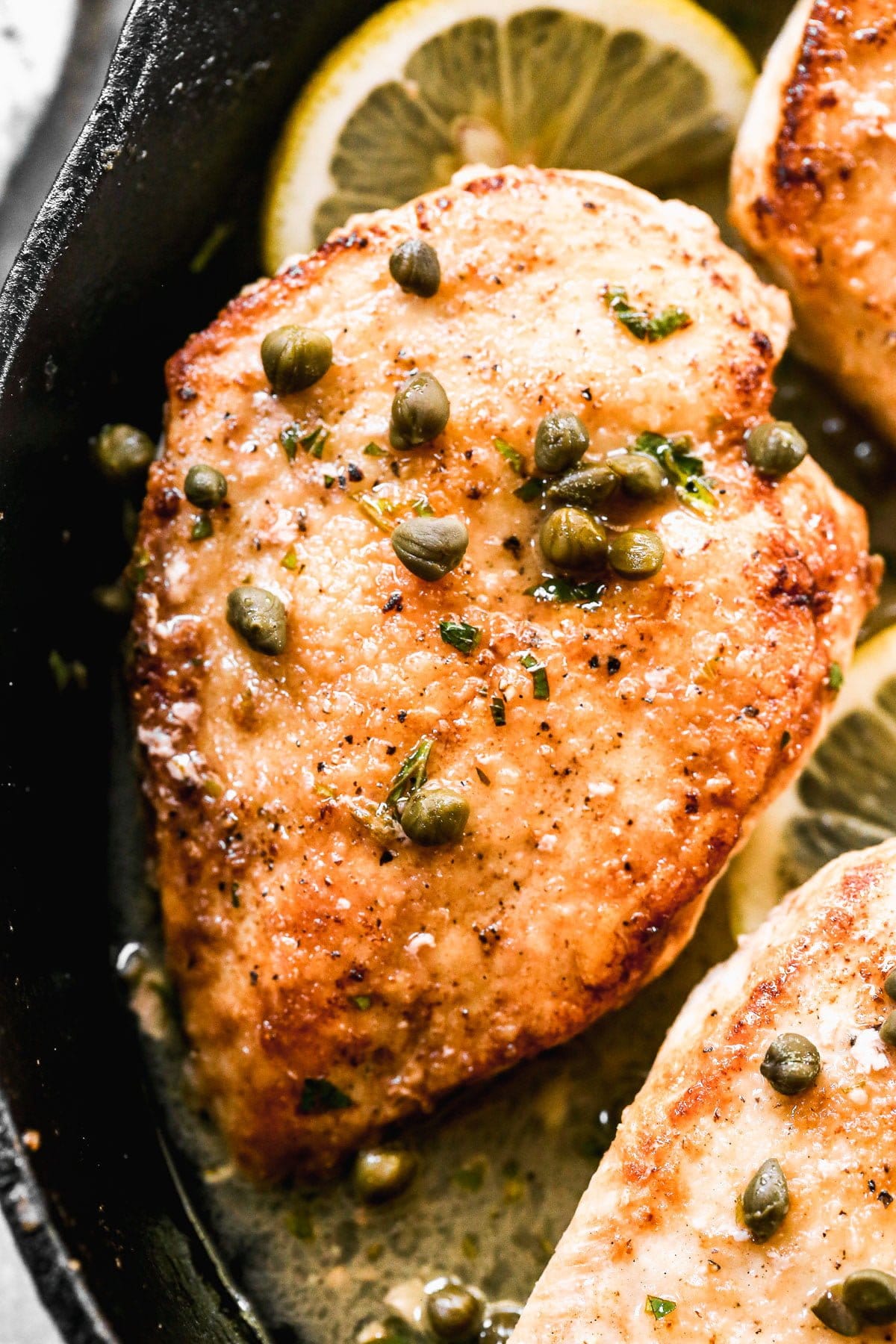 This Healthy Chicken Piccata Recipe&nbsp;will quickly become your new favorite weeknight dinner! Thin chicken breasts are sautéed in butter until crusty and golden brown, then smothered in a zippy lemon and white wine butter sauce. Easy, light and so delicious!&nbsp;