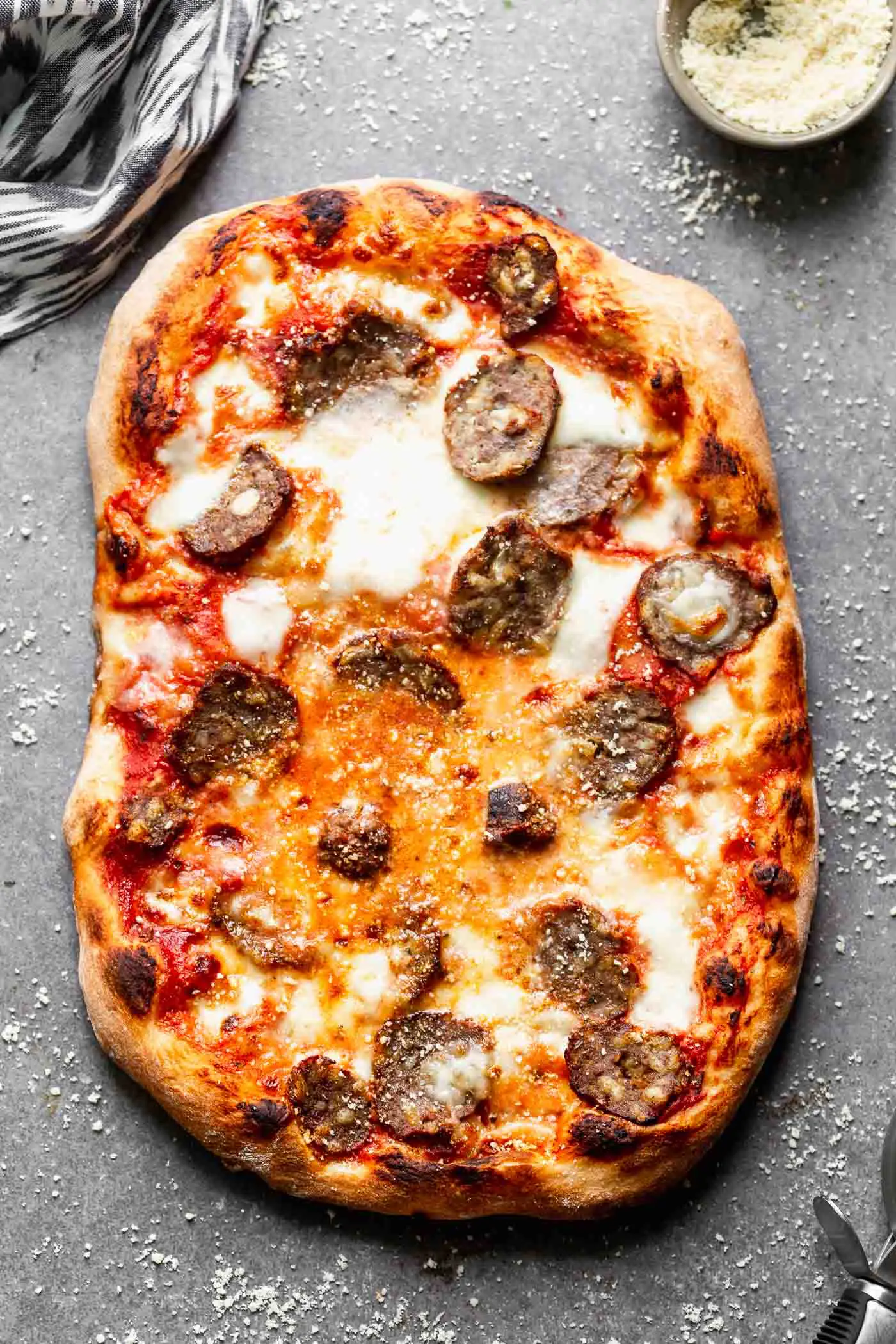 Tender, flavor-packed meatballs are sliced and layered with fresh mozzarella, parmesan cheese and a spaghetti and a meatball-inspired marinara sauce, in the <strong srcset=
