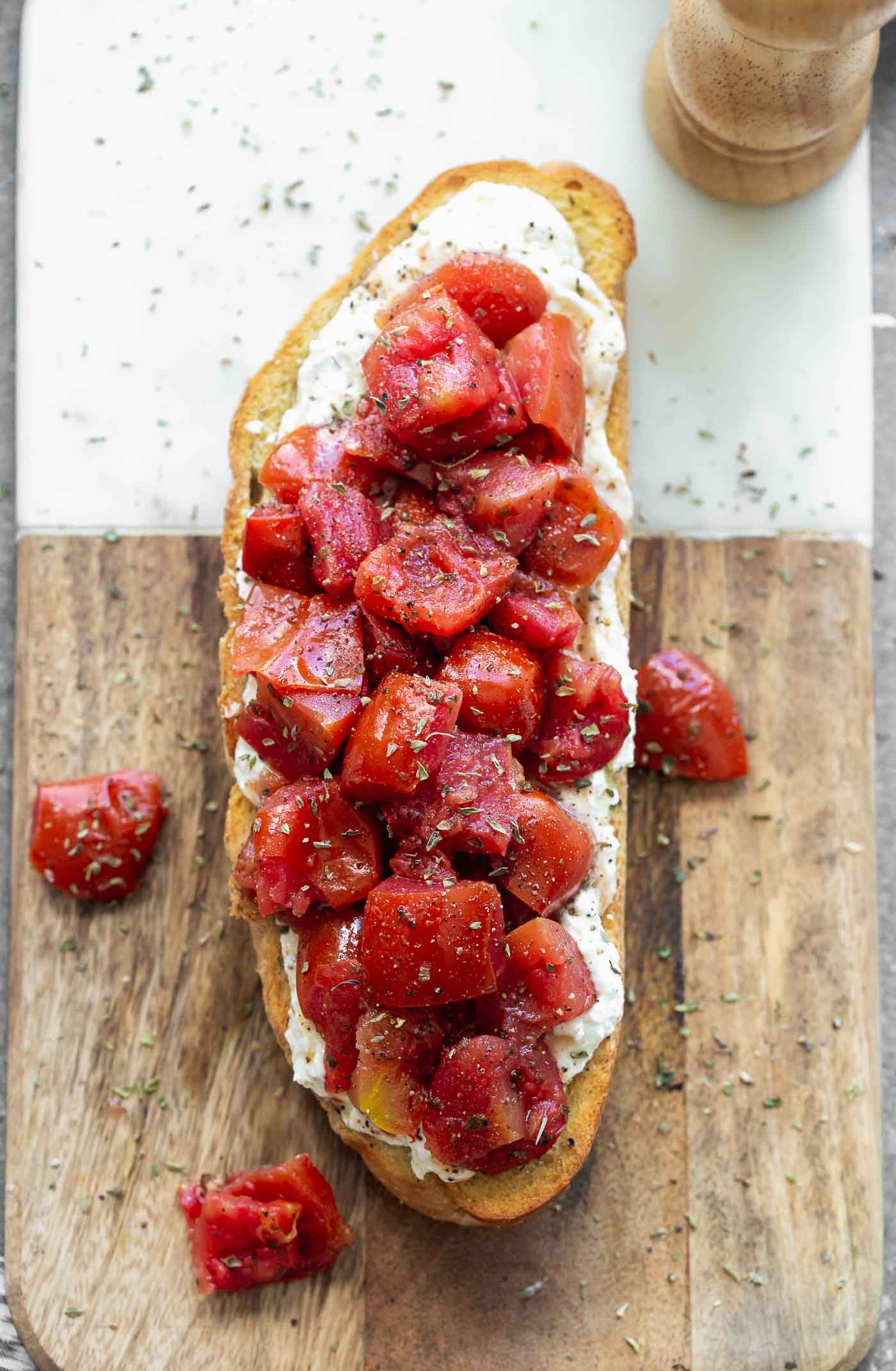 rispy French bread halves are seasoned with salt and pepper and baked until golden and crisp. They're brushed with garlic, then smothered with creamy whipped ricotta and topped with simply seasoned tomatoes. Serve with a crisp salad or as an appetizer! 