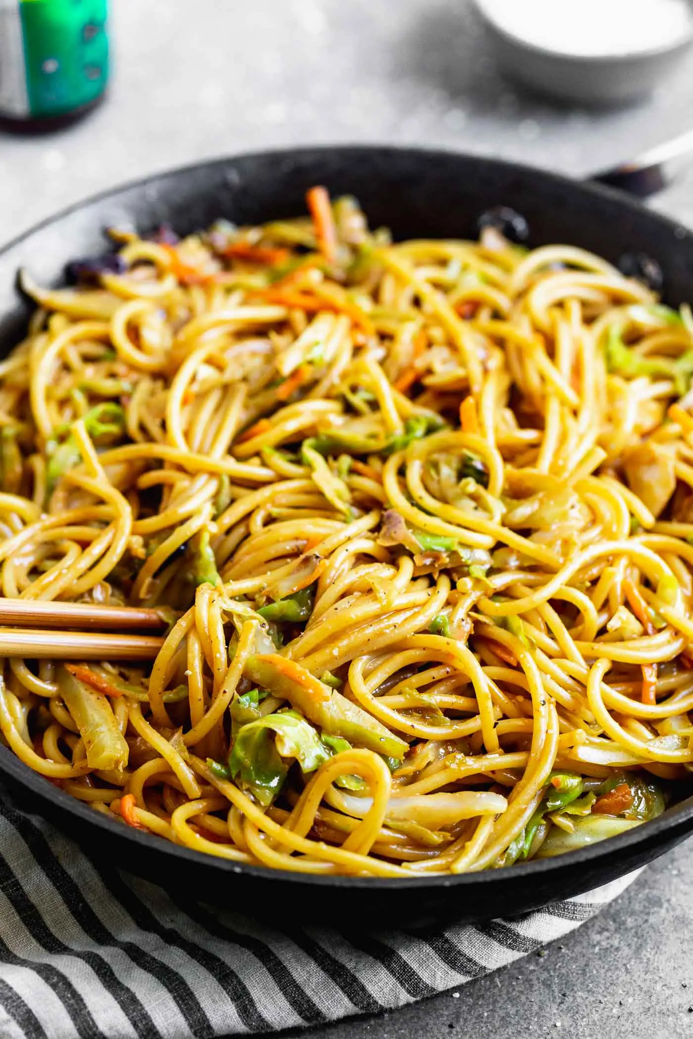 These 5-Ingredient Peanut Noodles are SO easy, and oh-so good. Thick spaghetti noodles are smothered in a hoisin-based peanut sauce, and tossed with a medley of cabbage and carrots for a delicious meal that comes together in minutes. 