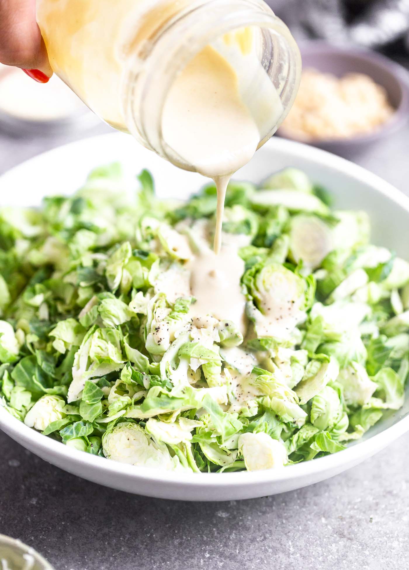 This 5-Ingredient Tahini Maple Dressing is our very favorite healthy salad dressing that goes with EVERYTHING. It's nutty, sweet, acidic, and the perfect balance of flavors. Make a big batch in a mason jar and store in the fridge for weeks!&nbsp;