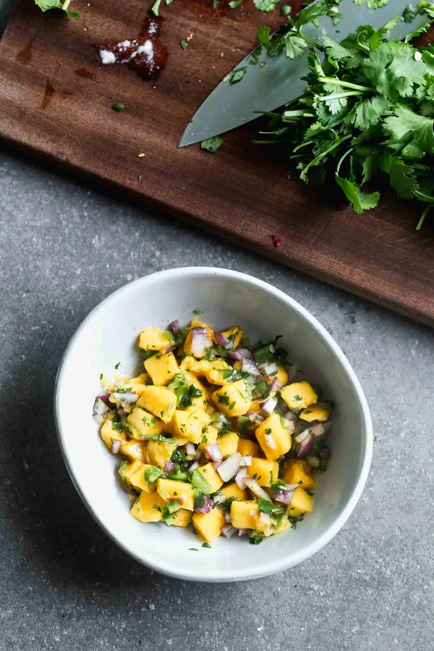 Easy mango salsa with cilantro, lime, red onion, and jalapeño 