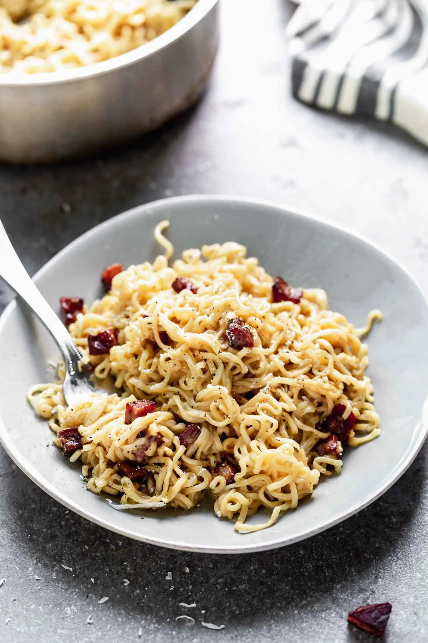 Carbonara noodles twisted on a fork
