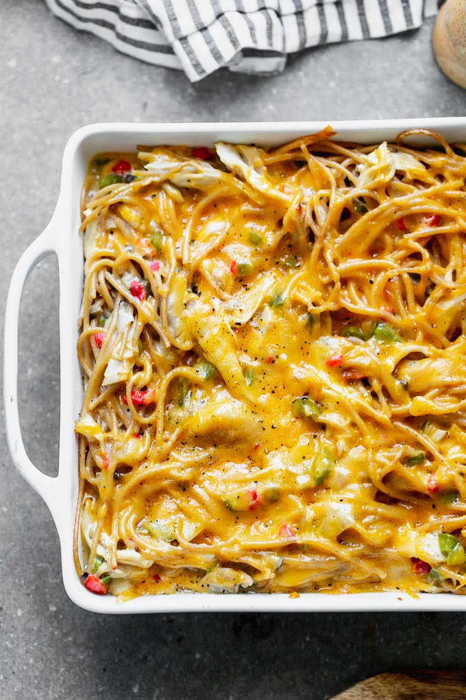 Healthy Chicken Spaghetti is an updated version of my favorite cheese chicken spaghetti from childhood, and SO delicious! Instead of using canned cream of mushroom, I make an easy homemade version, and mix it with sautéed veggies, whole-wheat spaghetti, plenty of shredded chicken, and of course, lots of cheese. The perfect back-to-school meal!