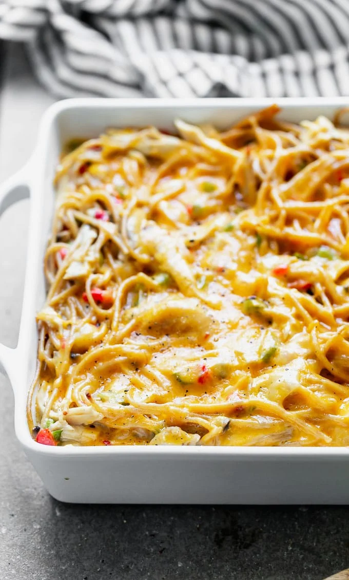 Healthy Chicken Spaghetti is an updated version of my favorite cheese chicken spaghetti from childhood, and SO delicious! Instead of using canned cream of mushroom, I make an easy homemade version, and mix it with sautéed veggies, whole-wheat spaghetti, plenty of shredded chicken, and of course, lots of cheese. The perfect back-to-school meal!