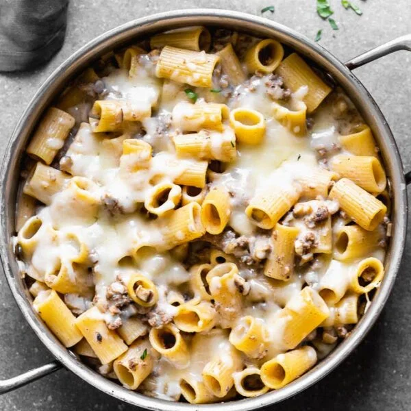 Cheesy Beef Stroganoff Pasta is a healthier, easier, and cheesier version of a classic! This stroganoff pasta is packed with seasoned ground beef, cremini mushrooms, perfectly aldente noodles and a creamy sauce made with Greek yogurt.