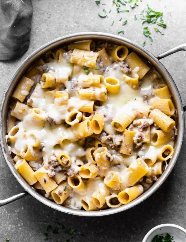 Cheesy Beef Stroganoff Pasta is a healthier, easier, and cheesier version of a classic! This stroganoff pasta is packed with seasoned ground beef, cremini mushrooms, perfectly aldente noodles and a creamy sauce made with Greek yogurt.