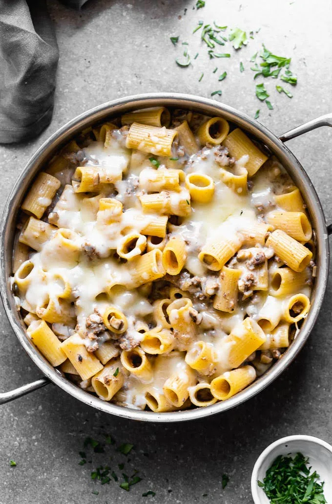 Cheesy Beef Stroganoff Pasta is a healthier, easier, and cheesier version of a classic! This stroganoff pasta is packed with seasoned ground beef, cremini mushrooms, perfectly aldente noodles and a creamy sauce made with Greek yogurt.