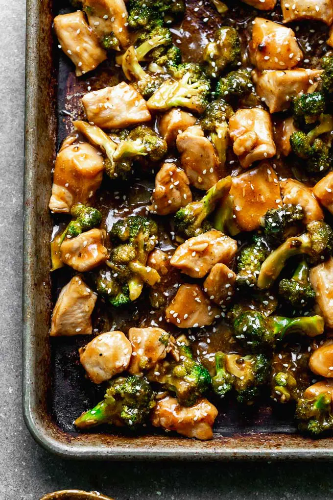 Chinese Chicken Broccoli Stir Fry is a healthier version of a classic, and it's all made in the oven! Tender chicken and crisp broccoli is tossed in a sweet soy glaze and served with simple white rice. Quick, easy, and virtually mess free!