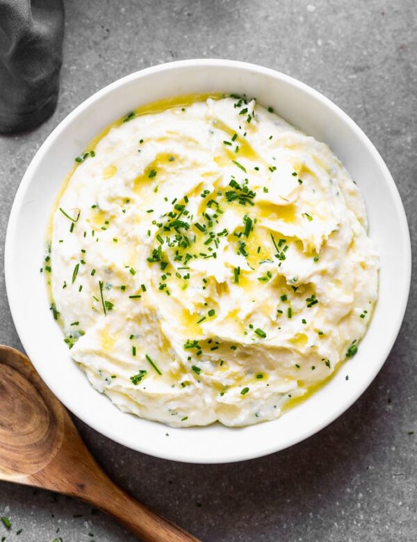 These Cream Cheese Mashed Potatoes are fluffy, smooth, ridiculously creamy and perfect for fall. They're a more straight-forward version of our ever-so-popular Best Creamy Mashed Potatoes, but we've swapped out the sour cream for luxurious cream cheese and plenty of chives for subtle onion flavor in each bite.  