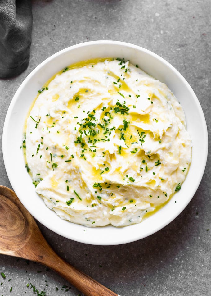 These Cream Cheese Mashed Potatoes are fluffy, smooth, ridiculously creamy and perfect for fall. They're a more straight-forward version of our ever-so-popular Best Creamy Mashed Potatoes, but we've swapped out the sour cream for luxurious cream cheese and plenty of chives for subtle onion flavor in each bite. &nbsp;