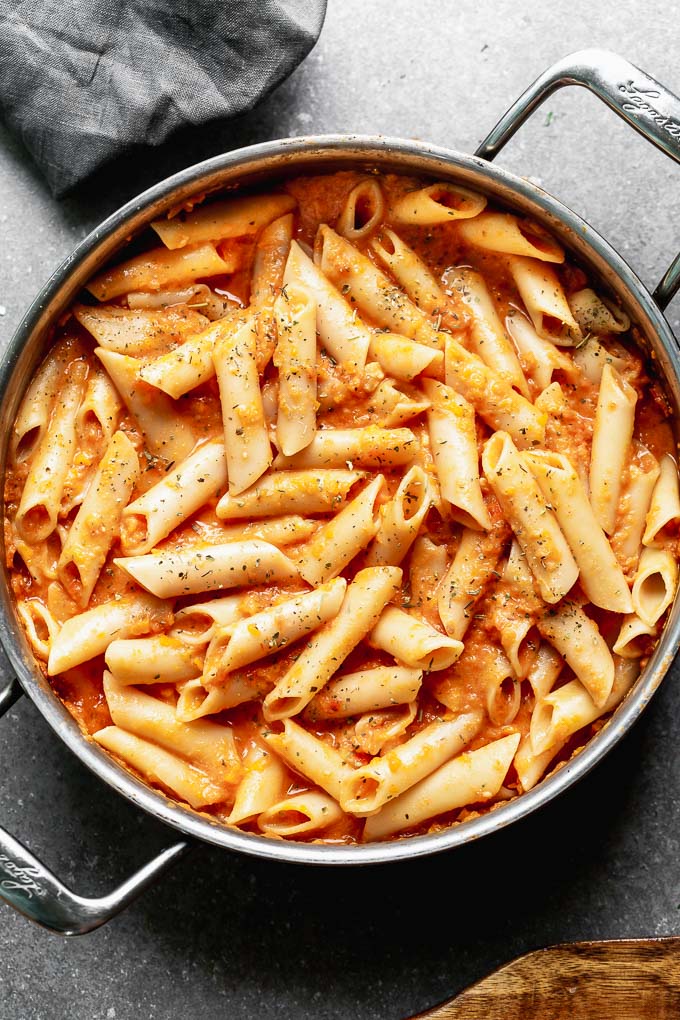 This Creamy Tomato Pasta Recipe is something we make at least a few times a month because it's easy to throw together and the whole family loves it! Bonus? It's packed with pureed carrots and Greek yogurt instead of cream, so it's also secretly healthy. A win for everyone.&nbsp;