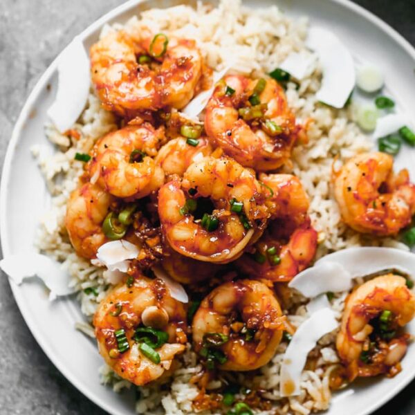 Caramel Shrimp with Coconut Rice: Sweet shrimp tossed in a salty brown sugar and soy sauce, studded with green onions, and served over coconut-infused rice to sop up all that delicious juice. Bonus? This is one of those 30-minute, no-fuss meals everyone in your family will love. 