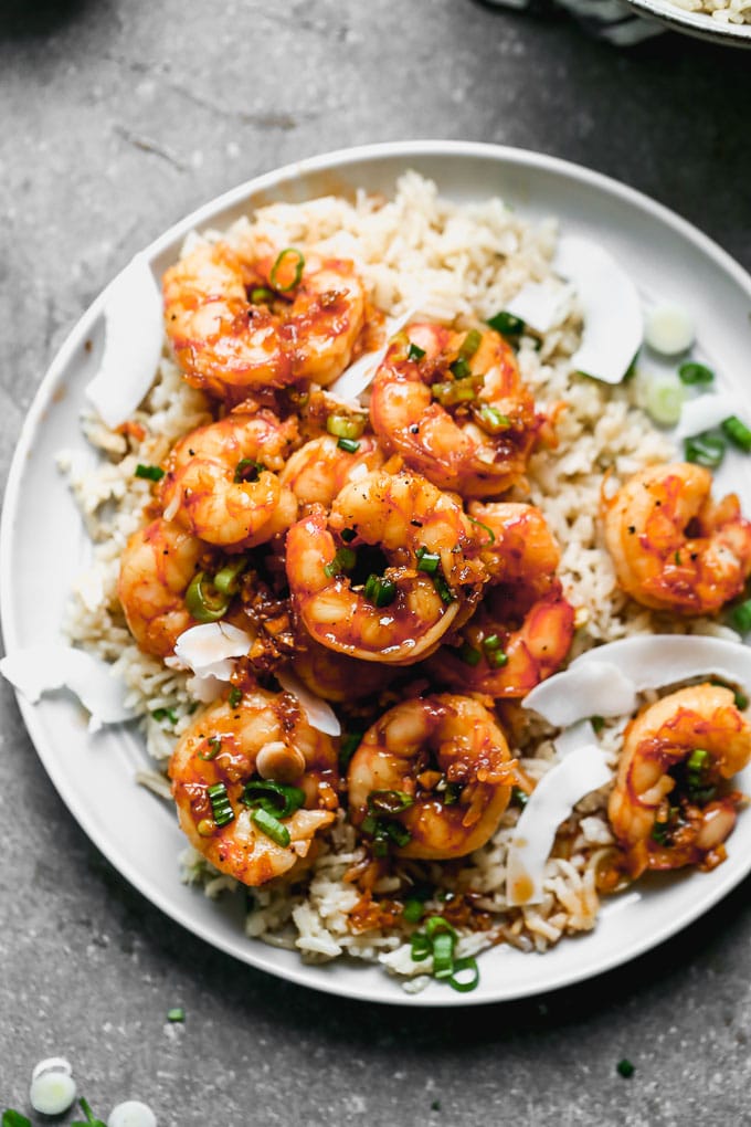 Caramel Shrimp with Coconut Rice: Sweet shrimp tossed in a salty brown sugar and soy sauce, studded with green onions, and served over coconut-infused rice to sop up all that delicious juice. Bonus? This is one of those 30-minute, no-fuss meals everyone in your family will love.&nbsp;