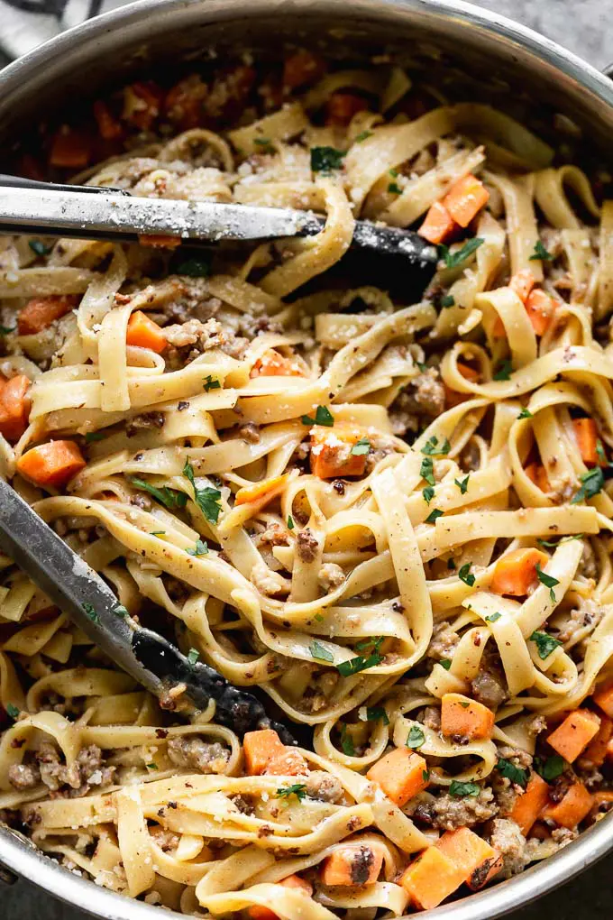 Toss pasta with sweet potatoes, sausage and sauce