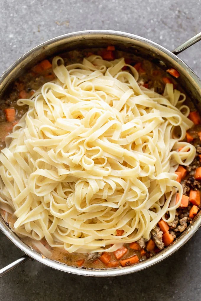 Add tagliatelle to the sausage and sweet potato mixture