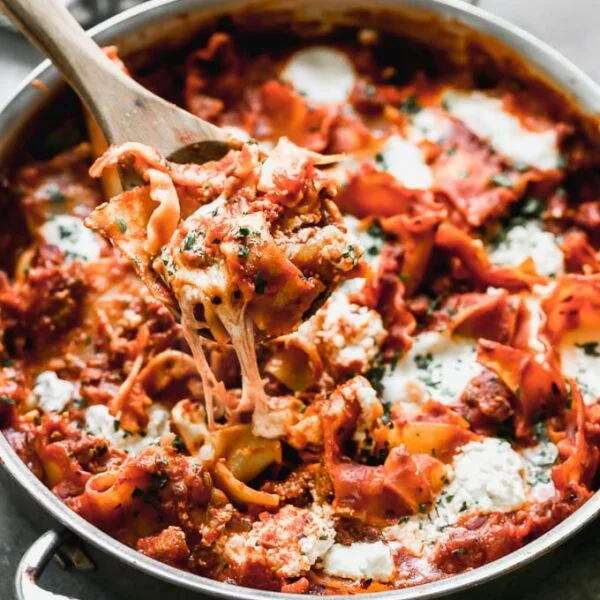 One Pot Deconstructed Lasagna is an easier, faster way to comforting lasagna! This is packed with an easy homemade red sauce, salty sausage, creamy ricotta cheese, and of course, plenty of gooey mozzarella cheese. It's the perfect way to enjoy lasagna any day of the week. 