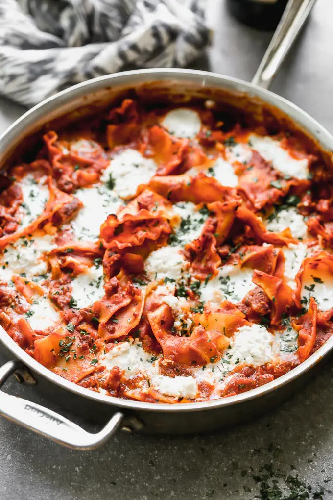 One Pot Deconstructed Lasagna is an easier, faster way to comforting lasagna! This is packed with an easy homemade red sauce, salty sausage, creamy ricotta cheese, and of course, plenty of gooey mozzarella cheese. It's the perfect way to enjoy lasagna any day of the week.&nbsp;