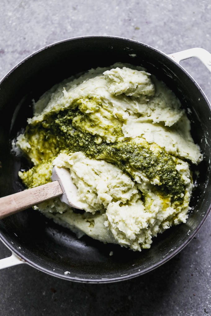 Swirl in ribbons of pesto to the mashed potatoes. 