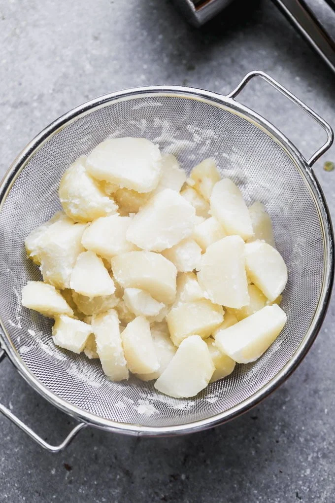 Let cooked potatoes dry completely in a colander before whipping them. 