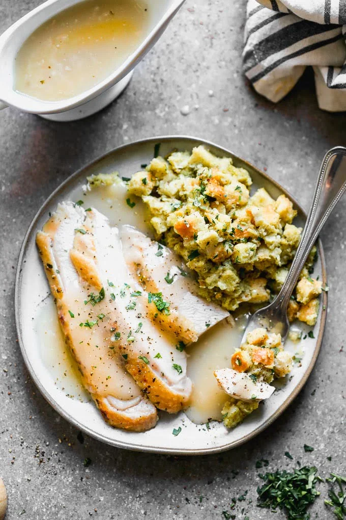 Sliced turkey and stuffing smothered in mashed potatoes