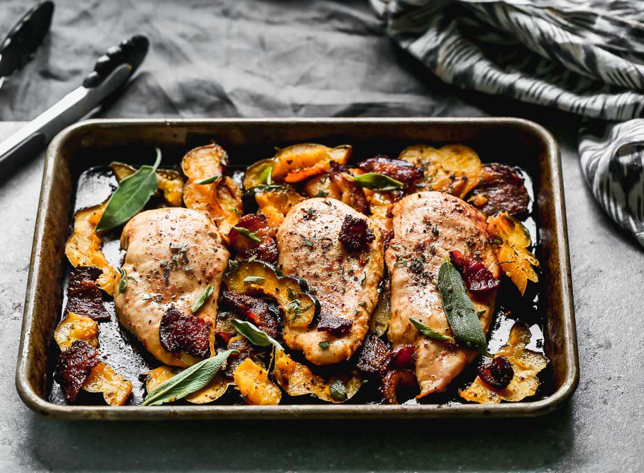 One Pan Chicken with Bacon and Acorn Squash is a fall weeknight dream. Tender chicken breasts are seasoned in a sweet and savory rub and baked with McCormick Grill Mates Brown Sugar Bourbon Bacon, plenty of sweet acorn squash, and lots of fresh sage. From start to finish One Pan Chicken takes less than 45 minutes to make, of which, most is hands off.&nbsp;