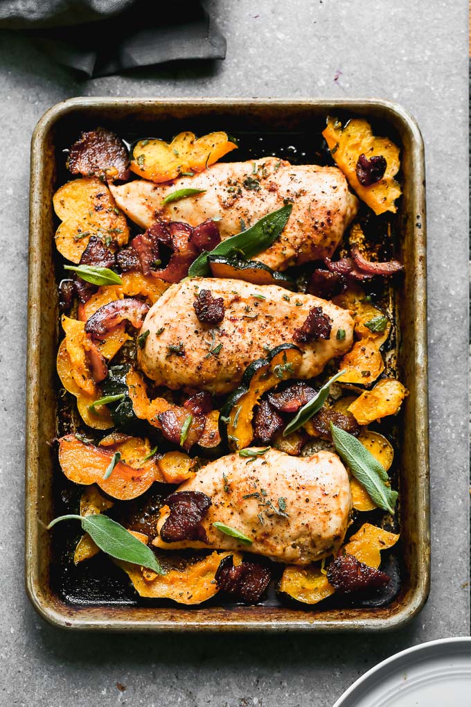 One Pan Chicken with Bacon and Acorn Squash is a fall weeknight dream. Tender chicken breasts are seasoned in a sweet and savory rub and baked with McCormick Grill Mates Brown Sugar Bourbon Bacon, plenty of sweet acorn squash, and lots of fresh sage. From start to finish One Pan Chicken takes less than 45 minutes to make, of which, most is hands off.&nbsp;