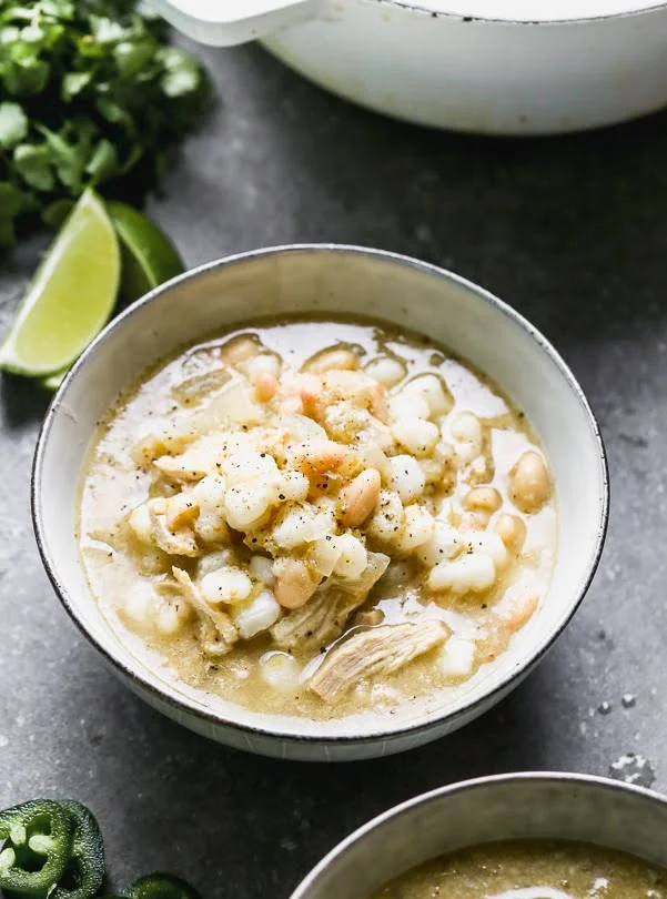 This Chicken Verde Soup is one of those soups that warms you from the inside out. It's slightly spicy from a jar of store-bought salsa verde and packed with onion, garlic, hints of cumin, and oregano. Heartiness comes in the form of shredded chicken, starchy hominy, and white beans. Bonus? It comes together in 30 minutes!