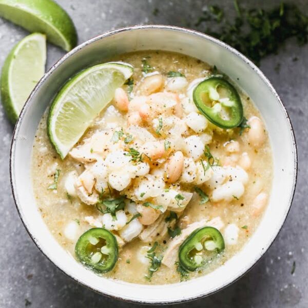 This Chicken Verde Soup is one of those soups that warms you from the inside out. It's slightly spicy from a jar of store-bought salsa verde and packed with onion, garlic, hints of cumin, and oregano. Heartiness comes in the form of shredded chicken, starchy hominy, and white beans. Bonus? It comes together in 30 minutes!