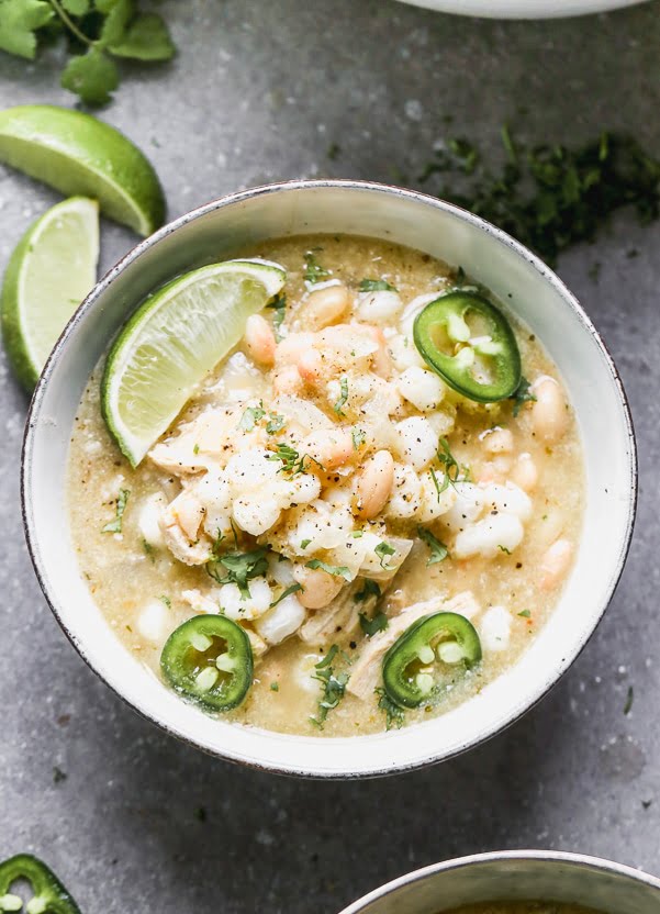 This Chicken Verde Soup is one of those soups that warms you from the inside out. It's slightly spicy from a jar of store-bought salsa verde and packed with onion, garlic, hints of cumin, and oregano. Heartiness comes in the form of shredded chicken, starchy hominy, and white beans. Bonus? It comes together in 30 minutes!