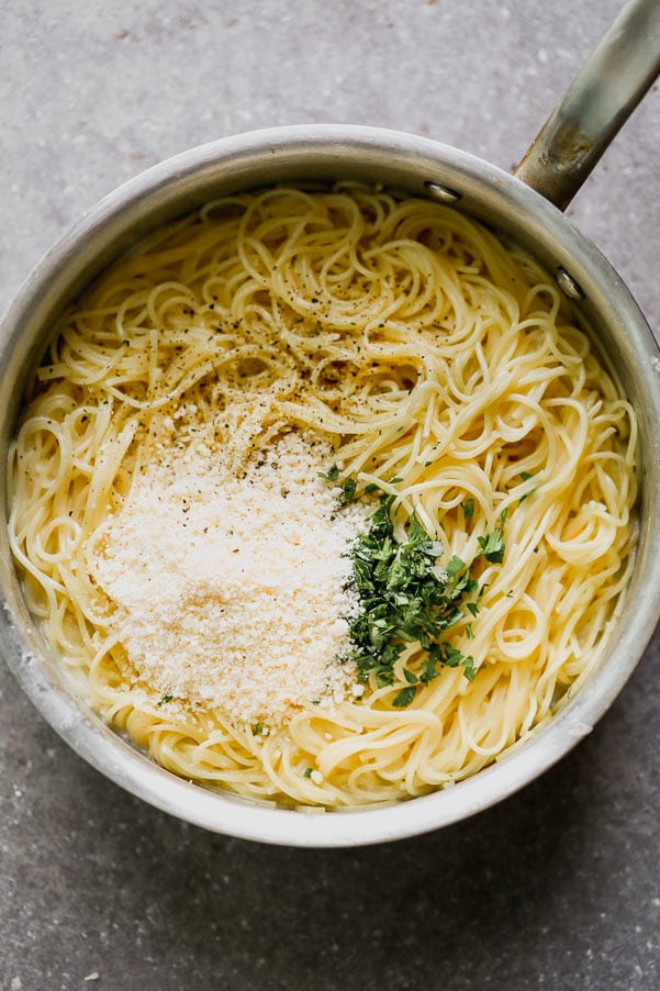 Add parmesan, chopped parsley and butter to the cooked angel hair pasta