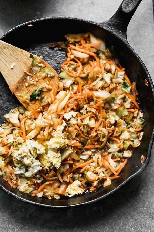 Saute cabbage, carrots, and cilantro. Stir fry egg. 