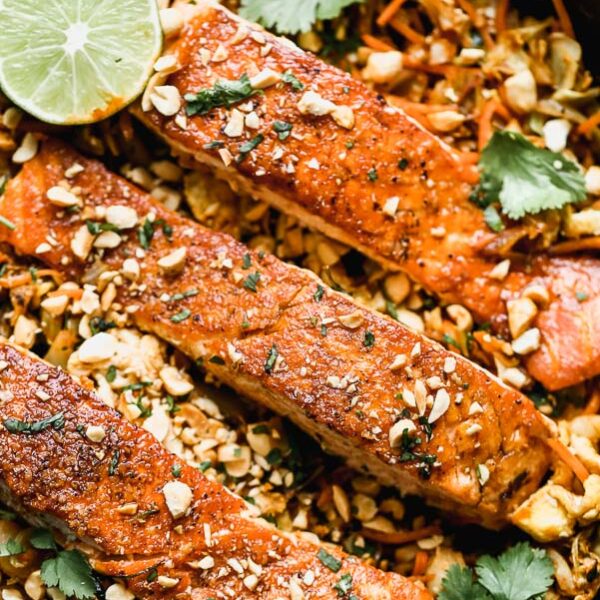 Pad Thai Salmon has all of the flavors of a classic pad Thai, but skips the noodles in lieu of sautéed veggies nestled beneath a crispy filet of salmon. Quick, easy, and healthy!  