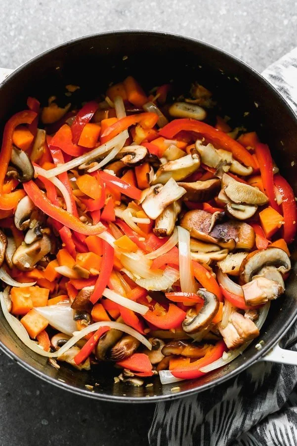 Saute mushrooms, sweet potato, onions, and red bell pepper. 