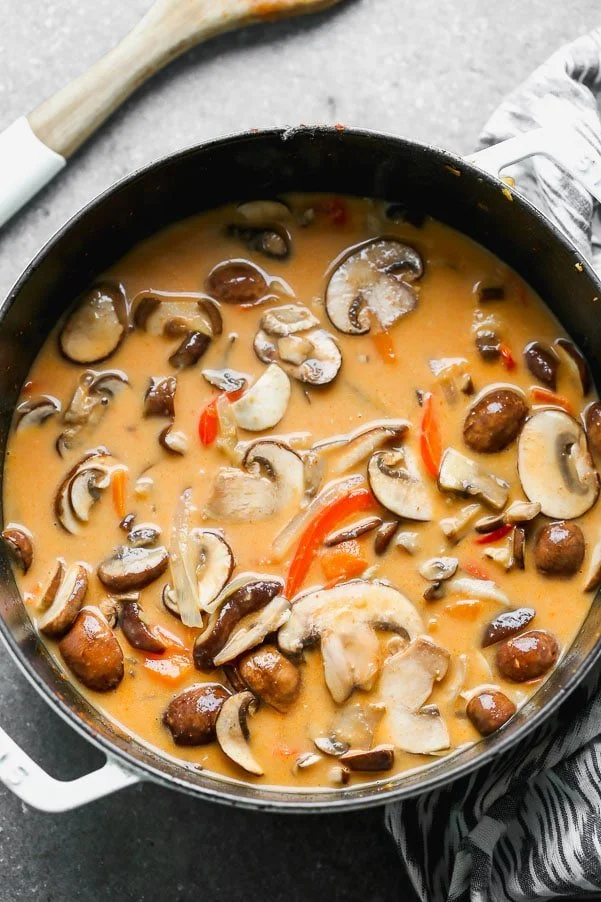 Coconut curry broth with mushrooms, sweet potatoes, and peppers. 