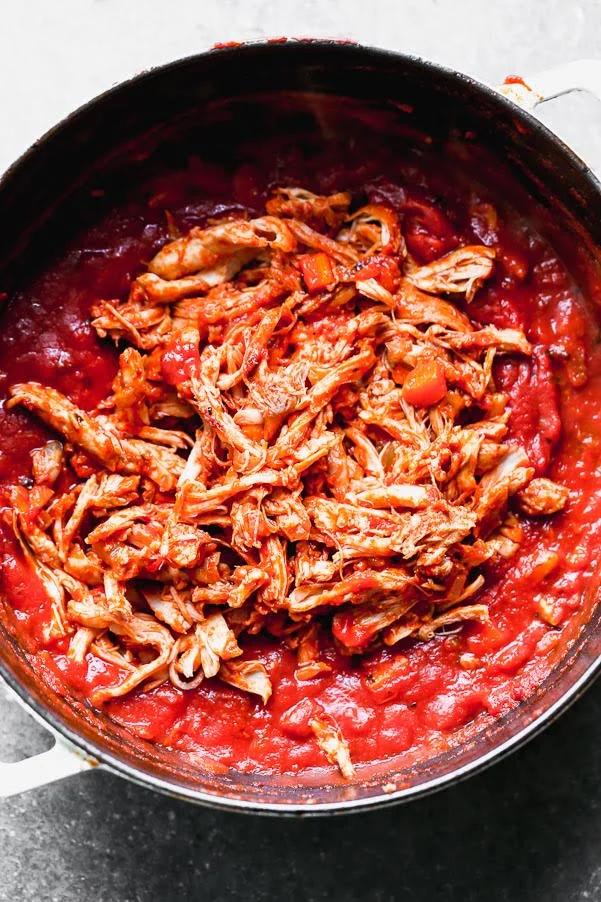Add shredded chicken back to the sauce. 