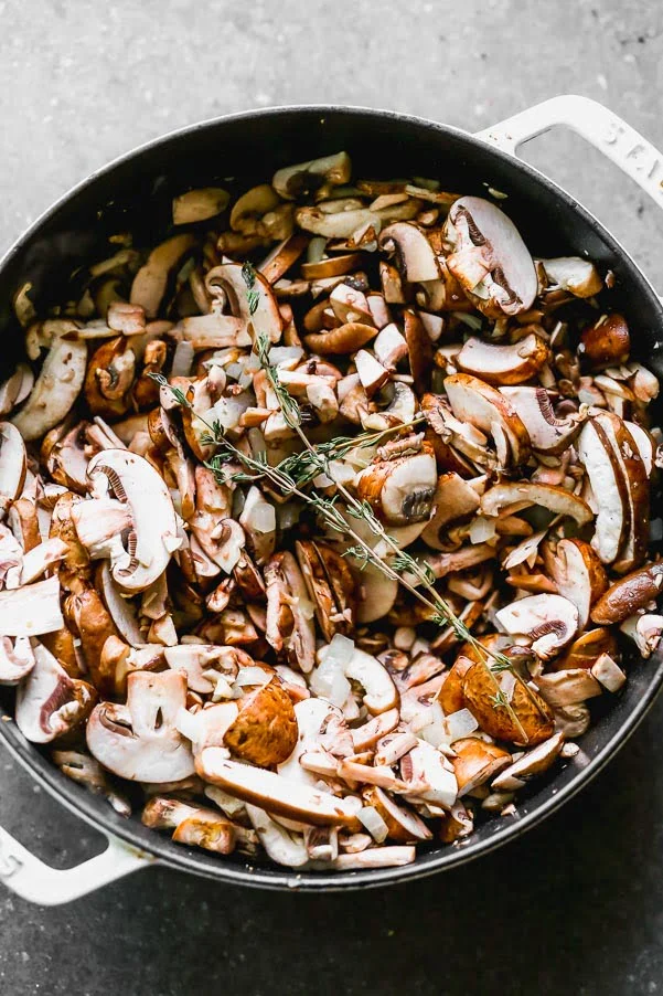Saute mushrooms with fresh thyme leaves