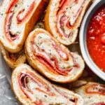 Italian Stromboli is only five ingredients and packed with spicy pepperoni, capicola and gooey mozzarella cheese, plus a simple pizza seasoning. So easy!