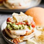 These Spicy Mexican Burgers are packed with all the best classic taco components. Spicy, smoky chicken patties, covered in gooey pepper jack cheese and smothered with smashed avocado, hot salsa, and crunchy tortilla chips.