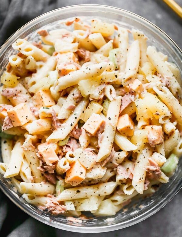 This Creamy Tuna Pasta Salad with Pineapple is one of my favorite lunches to make when I need to throw something together quickly from the pantry. Aldente penne noodles are tossed with flaked tuna, pineapple, crunchy celery, and creamy American cheese. Everything is then tossed in a super light mayo-based dressing that won't weigh you down.