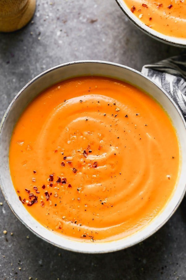 Spicy Carrot Soup is simple, full of sweet carrot flavor, and the perfect transition from winter to spring. With only seven easy-to-grab ingredients, and only 30 minutes between prep and cook time, this is the soup you want to make right now.