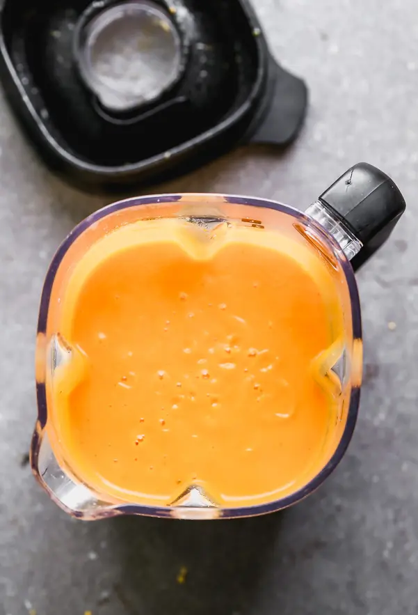 Blend the carrot soup until smooth