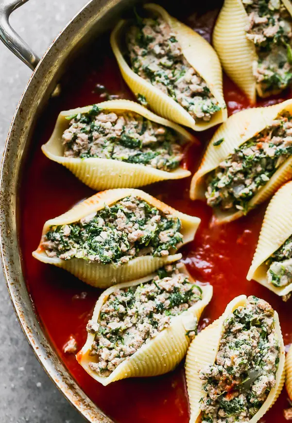 Arrange stuffed shells in a large skillet