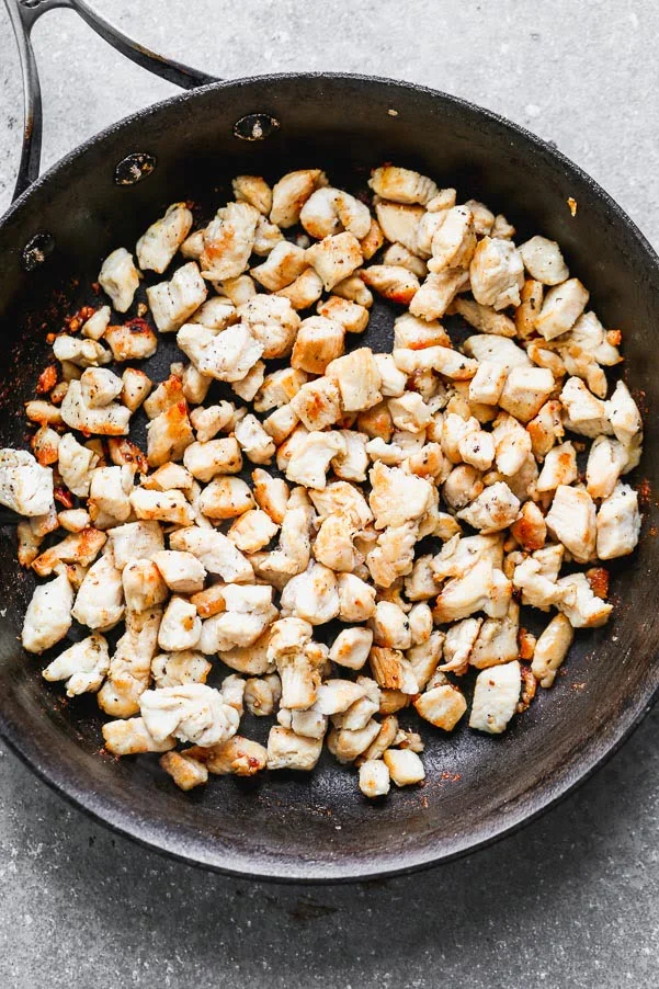 Brown the chicken in sesame oil until crispy and brown. 