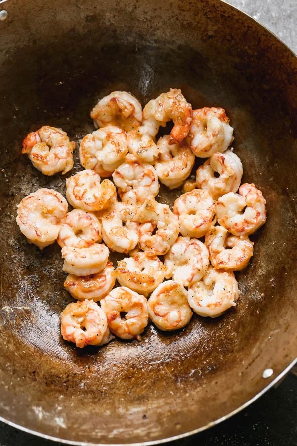 Stir-fry shrimp in canola oil.