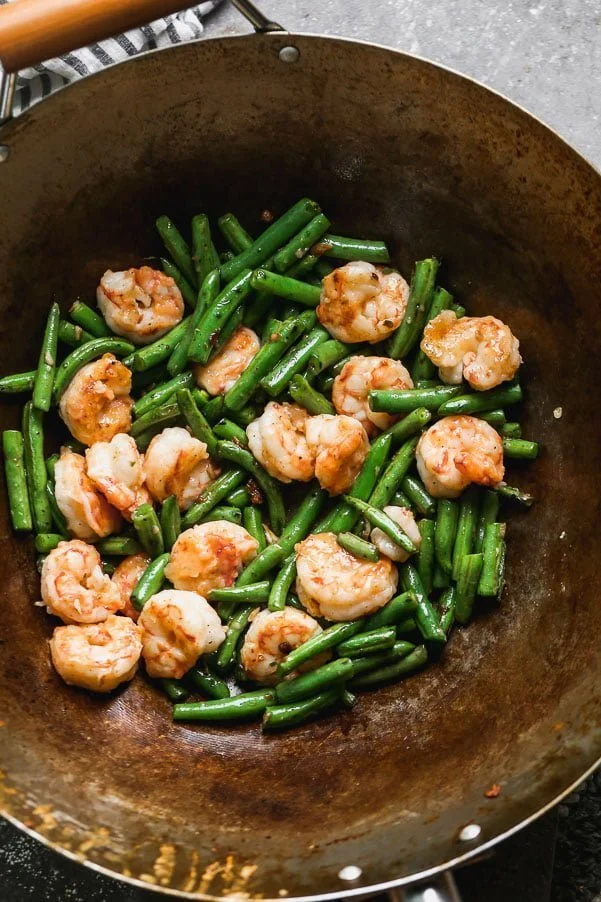 Toss green beans and shrimp together