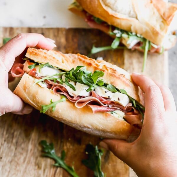 This classic French Baguette Sandwich, also known as a Jambon Beurre Sandwich is such a nice departure from a classic deli sandwich. Our version is layered on a crusty French baguette with salty prosciutto, an easy herbed butter, creamy brie, and peppery arugula. Effortlessly elegant, and most importantly, so delicious. 