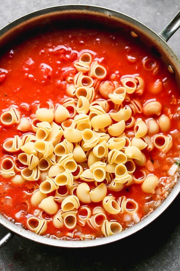 Cook the tomato sauce with the pasta noodles. 